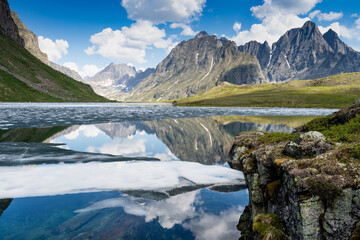 A beautiful mountain lake against the background of the Kodar mountains. Trans-Baikal Territory, Kodar National Park.