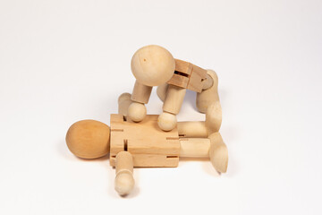 Wooden man. First aid, indirect heart massage, brings a person to consciousness.