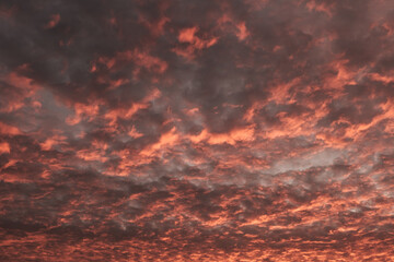 Textured dramatic clouds on bloody sky