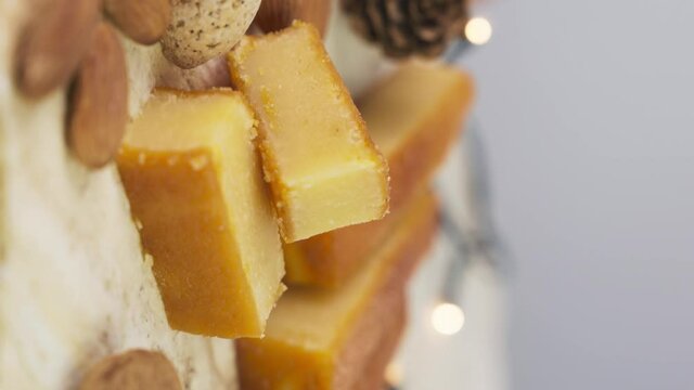 Vertical Shot Of Delicious Yema Tostada Turron Served In A Plate, A Southern European Nougat Confection. close up