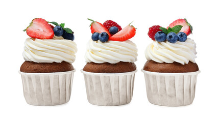 Sweet cupcakes with fresh berries on white background