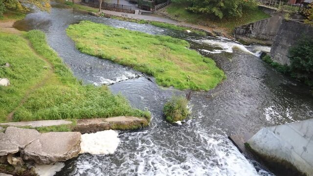 Top view of a river flowing through dam