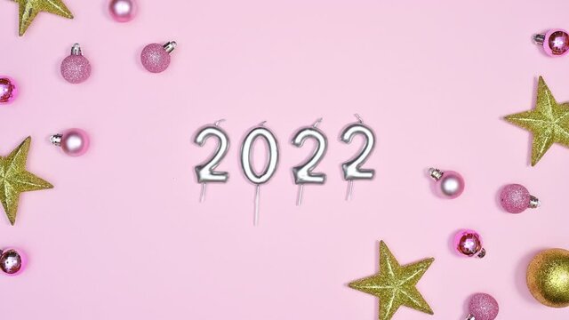 Christmas And New Year Stop Motion With Glitter Ornaments And 202? Transform Into 2022