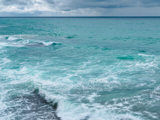 view of ocean waves and a fantastic rocky shore