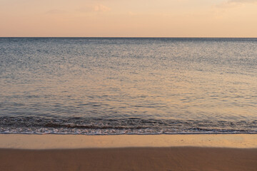 Fototapeta premium Calm sea at sunset. Ocean shore background.