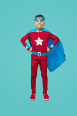 Courageous superhero boy in colorful costume