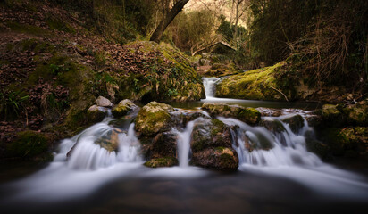 Fototapeta premium Waterfall in the Cerezuelo river in the city of Cazorla, province of Jaen. Beautiful relaxing and peaceful waterfall in Andalucia.