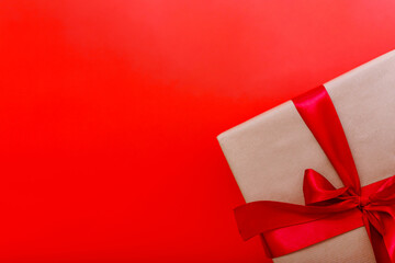 Christmas gift box on red background. Holiday concept. Presents on red backdrop