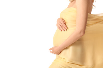 Fototapeta na wymiar Young pregnant woman in light cloth on white background
