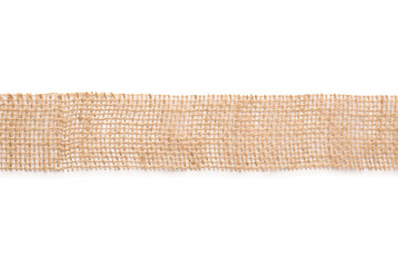 Wide burlap ribbon on white background, top view