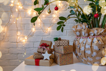 Houseplant with Xmas decorations close up as alternative hipster Christmas tree. Eco friendly Christmas decor and gifts zero waste