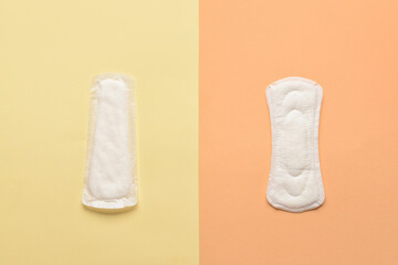 Menstrual pads on yellow background © Pixel-Shot