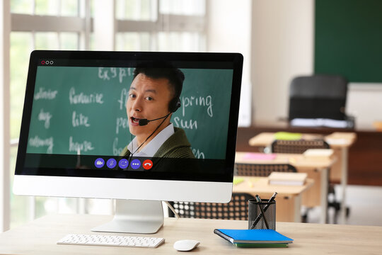 School teacher conducting lesson online
