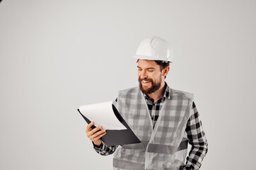 engineer with documents and drawings blueprints studio industry