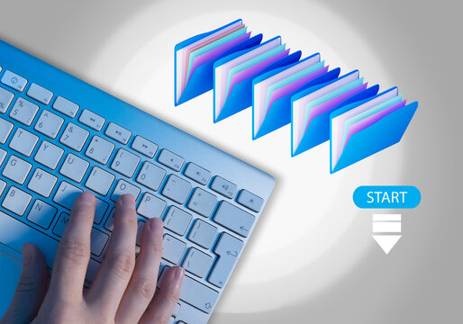 Data analytics concept. File folder icons represent big data. Person is working on data analytics. Human hands on keyboard. Processing of electronic information. Start information processing