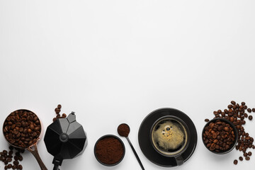 Flat lay composition with coffee grounds and roasted beans on white background, space for text