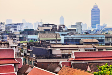 A panoramic view of the old district of Bangkok, Thailand and skyscrapers as background, foggy