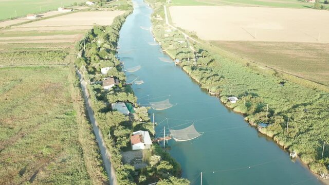 Aerial view of fishing huts in the river, Lido di Dante, Fiumi Uniti, Ravenna near Comacchio valley.