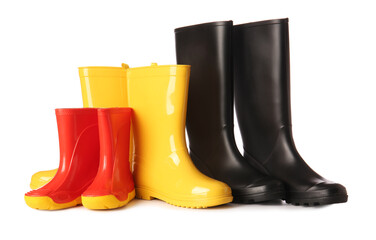 Many different rubber boots isolated on white background