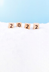 2022 composed of Wooden blocks on the snow. 雪上にある木製のブロックで構成された2022年	