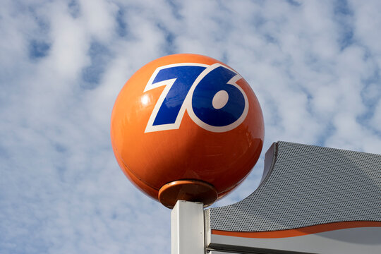 Hillsboro, OR, USA - Nov 17, 2021: Closeup of the 76 orange globe sign at a 76 gas station in Hillsboro, Oregon. 76 (formerly Union 76) is a chain of gas stations owned by the Phillips 66 Company.