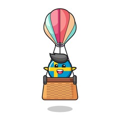 sweden flag mascot riding a hot air balloon