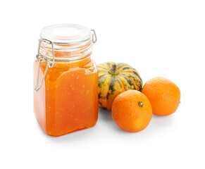Fototapeta na wymiar Jar of sweet pumpkin jam with oranges on white background