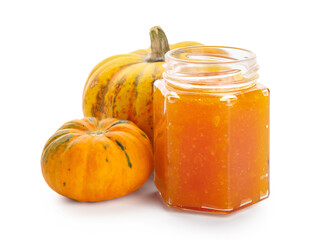 Jar of sweet pumpkin jam on white background