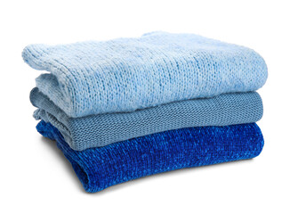 Stack of stylish blue sweaters on white background