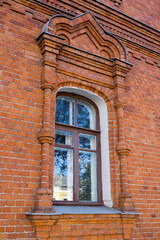 Fototapeta na wymiar A beautiful window of an old brick building.