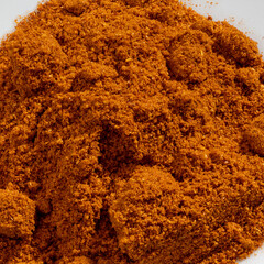 Detailed and large close up shot of powdered paprika spice.