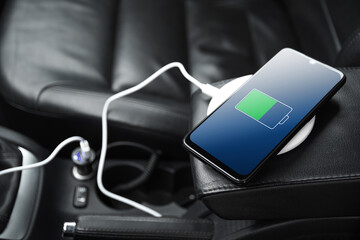 Mobile phone ,smartphone, cellphone is charged ,charge battery with usb charger in the inside of...