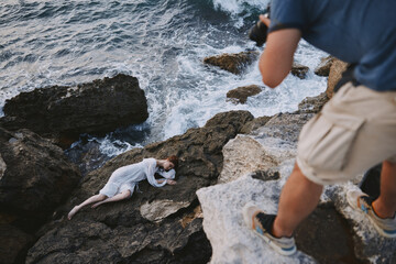 woman lies on a stone near the sea nature landscape unaltered