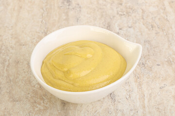 Organic mustard sauce in the bowl