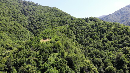 Fototapeta na wymiar top view aerial drone fligh over green mountains landscape inspirational video