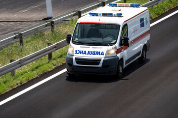 Ambulance. Special medical vehicles. Ambulance van on road. Ambulance service van on street. Ambulances drive on the new highway.	