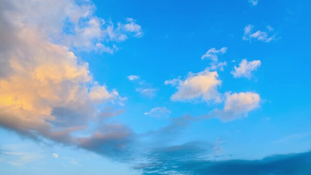 Yellow sky clouds on blue sky at sunset