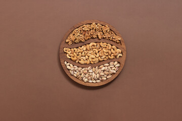 assorted different nuts on a background with a place for text