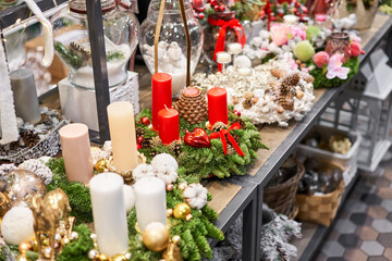 Christmas wreaths with four candles. Market of decor . Lots of christmas decoration in store. Christmas shopping for new year tree.