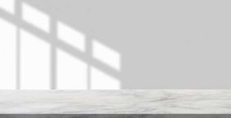 Fototapeta premium Marble table with window shadow drop on white wall background for mockup product display