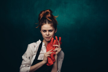 woman with rubber gloves in apron cleaning housework