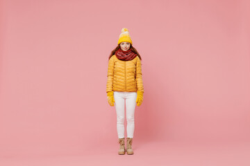 Full size body length fascinating young woman 20s years old wears yellow jacket hat mittens looking...