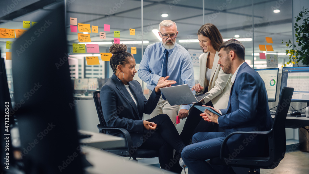 Poster in modern office: diverse team of managers use laptop and tablet computers at a company meeting disc