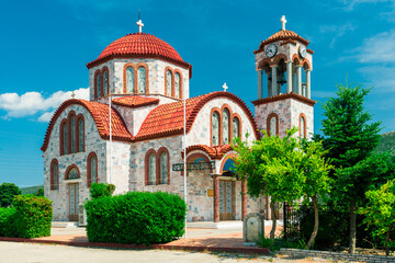 Fototapeta na wymiar Greek typical church with red roofing, Greece