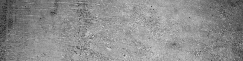 Gray concrete wall. Cement surface texture. Grunge background with copy space for design. Web banner. Website header.