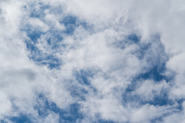 The bright blue sky was surrounded by white clouds, the atmosphere was like heaven.