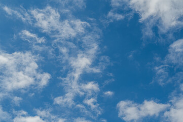 The bright blue sky was surrounded by white clouds, the atmosphere was like heaven.