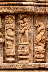 Temple platform of Jagamohana carved with  erotic couples, young women flaunting their beauty in poses, nagas, vyalas, soldiers, elephants, court scenes Sun Temple Konark, Odisha, India.
