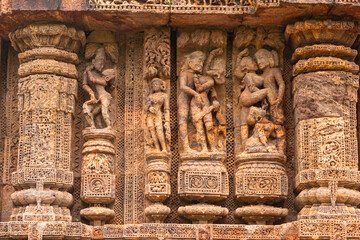 Temple platform of Jagamohana carved with  erotic couples, young women flaunting their beauty in...
