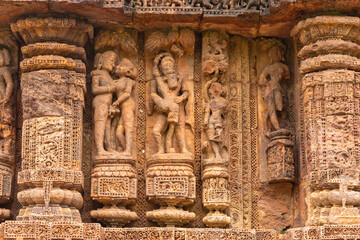 Temple platform of Jagamohana carved with  erotic couples, young women flaunting their beauty in poses, nagas, vyalas, soldiers, elephants, court scenes Sun Temple Konark, Odisha, India.